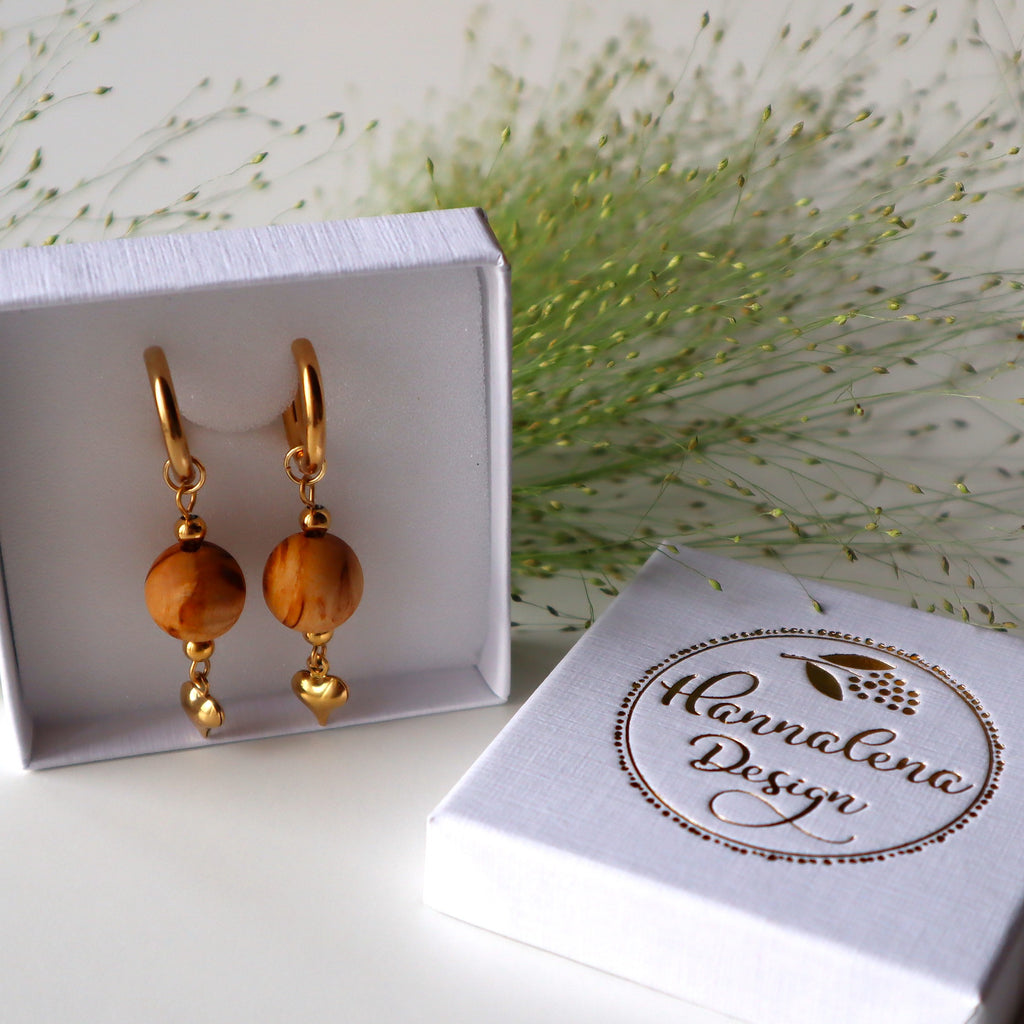 Lovisa-rengaskorvakorut kullattua kirurginterästä ja suomalaista visakoivua